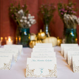 teal and gold wedding escort cards